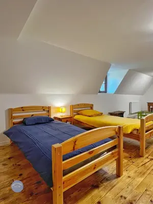 Un ou plusieurs lits dans un hébergement de l'établissement Les Glycines - Maison familiale avec jardin, entre nature et confort