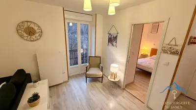 Un ou plusieurs lits dans un hébergement de l'établissement Le Capucine Le Mont-Dore