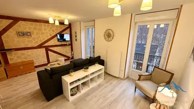 Télévision ou salle de divertissement dans l'établissement Le Capucine Le Mont-Dore