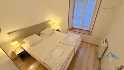 Un ou plusieurs lits dans un hébergement de l'établissement Le Capucine Le Mont-Dore