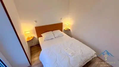Un ou plusieurs lits dans un hébergement de l'établissement Le Capucine Le Mont-Dore