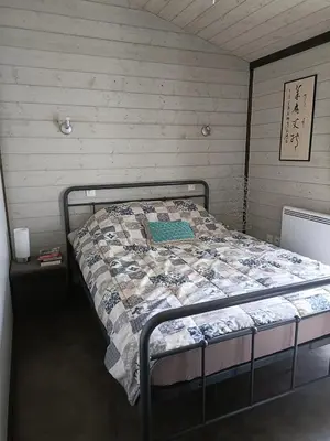 Un ou plusieurs lits dans un hébergement de l'établissement Chalet familial à proximité de Vulcania