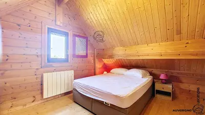 Un ou plusieurs lits dans un hébergement de l'établissement Chalet Puy Jumel