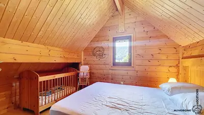 Un ou plusieurs lits dans un hébergement de l'établissement Chalet Puy Jumel