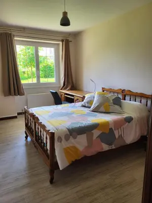 Un ou plusieurs lits dans un hébergement de l'établissement Appartement avec jardin privé