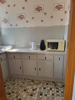 Cuisine ou kitchenette dans l'établissement Appartement avec jardin privé