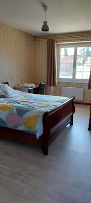 Un ou plusieurs lits dans un hébergement de l'établissement Appartement avec jardin privé