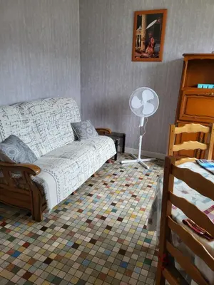 Coin salon dans l'établissement Appartement avec jardin privé