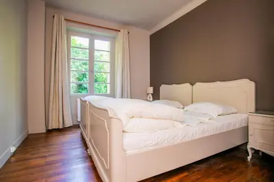 Un ou plusieurs lits dans un hébergement de l'établissement Family Villa - Laroche Martel