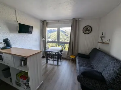 Coin salon dans l'établissement Studio cabine rénové avec vue sur le centre, WiFi et animaux acceptés - FR-1-787-117