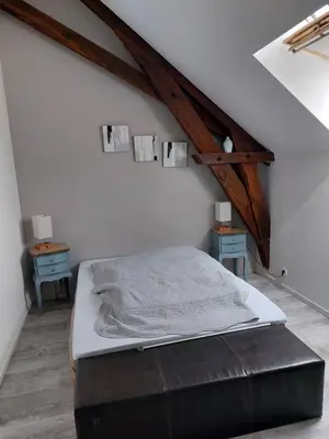 Un ou plusieurs lits dans un hébergement de l'établissement Maison à la campagne