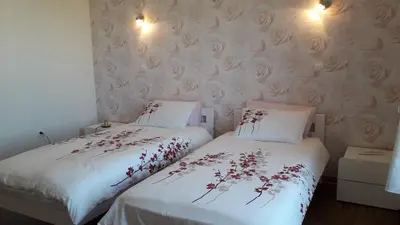 Un ou plusieurs lits dans un hébergement de l'établissement La Maison en Cézallier - Roses