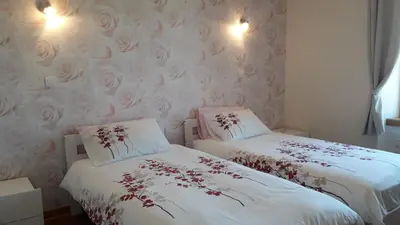 Un ou plusieurs lits dans un hébergement de l'établissement La Maison en Cézallier - Roses