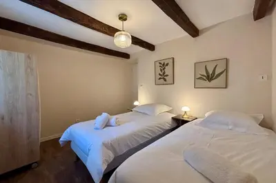 Un ou plusieurs lits dans un hébergement de l'établissement Casa Les Combes - Maison typique climatisé avec jardin