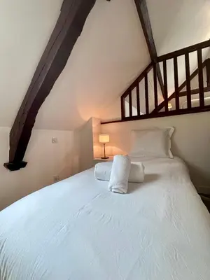 Un ou plusieurs lits dans un hébergement de l'établissement Maison de Perpezac - Jardin & Clim - 7 personnes - Perpezac-le-Noir