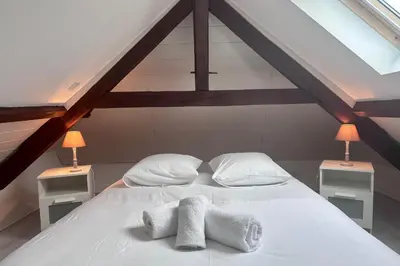 Un ou plusieurs lits dans un hébergement de l'établissement Maison de Perpezac - Jardin & Clim - 7 personnes - Perpezac-le-Noir