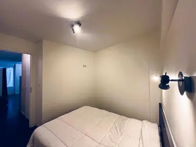 Un ou plusieurs lits dans un hébergement de l'établissement Appartement mont dore 4 personnes