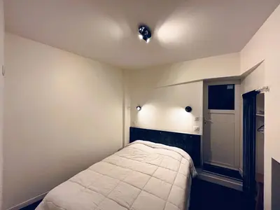 Un ou plusieurs lits dans un hébergement de l'établissement Appartement mont dore 4 personnes