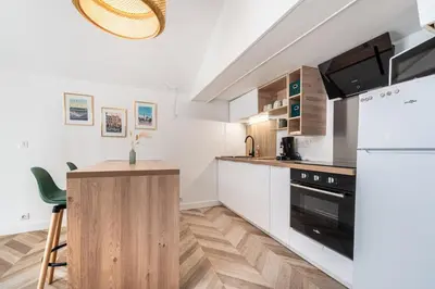 Cuisine ou kitchenette dans l'établissement Le Duplex D'Andromely, Centre-historique-Animé