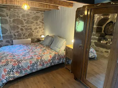 Un ou plusieurs lits dans un hébergement de l'établissement La maison des petites choses, la tiny house du Puy Mary-Cantal