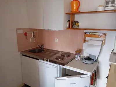 Cuisine ou kitchenette dans l'établissement Location saisonnière