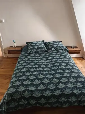 Un ou plusieurs lits dans un hébergement de l'établissement Grand appartement avec belle vue