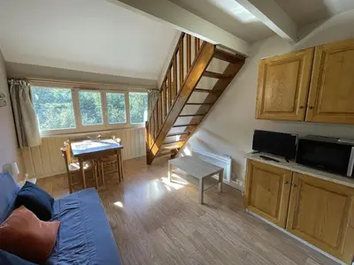 Coin salon dans l'établissement Charmant Duplex pour 5 pers., Wi-Fi & Parking au Lioran - FR-1-787-108
