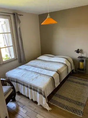 Un ou plusieurs lits dans un hébergement de l'établissement Petite maison ancienne dans le lot