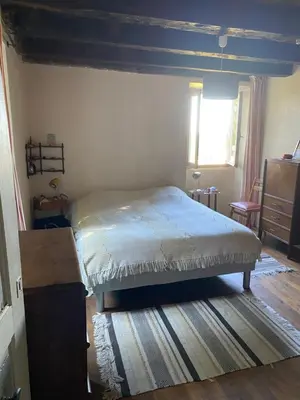Un ou plusieurs lits dans un hébergement de l'établissement Petite maison ancienne dans le lot