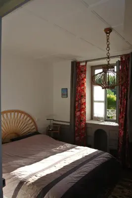 Un ou plusieurs lits dans un hébergement de l'établissement Charmante maison ancienne en Corrèze