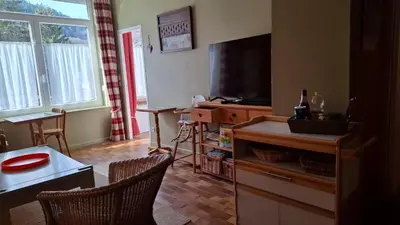 Télévision ou salle de divertissement dans l'établissement Les Tomettes - Le Mont-Dore