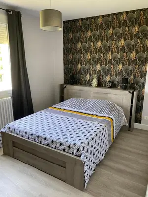 Un ou plusieurs lits dans un hébergement de l'établissement Maison les tilleuls