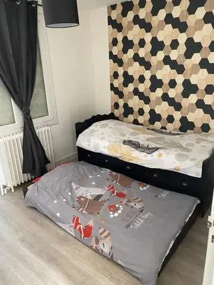 Un ou plusieurs lits dans un hébergement de l'établissement Maison les tilleuls