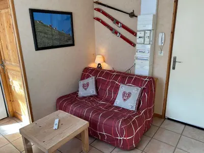 Coin salon dans l'établissement Val-locations marmotte 5