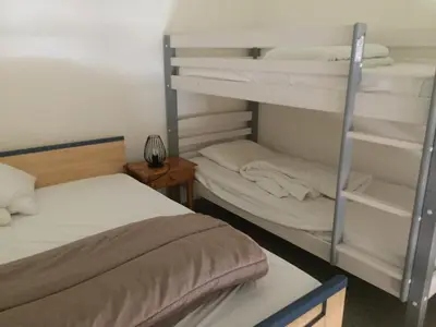 Un ou plusieurs lits dans un hébergement de l'établissement Résidence Azur Sancy
