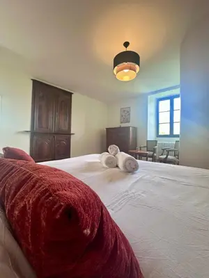 Un ou plusieurs lits dans un hébergement de l'établissement Maison de la Fontaine - Typique - Bourg de Collonges