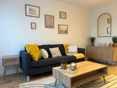 Coin salon dans l'établissement Appartement de standing rénové