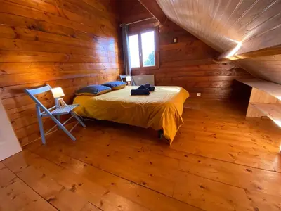 Un ou plusieurs lits dans un hébergement de l'établissement Le chalet de Flo