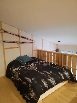 Un ou plusieurs lits dans un hébergement de l'établissement Refuge chaleureux pour des vacances en famille