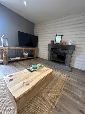 Télévision ou salle de divertissement dans l'établissement Grand duplex au coeur de Murat