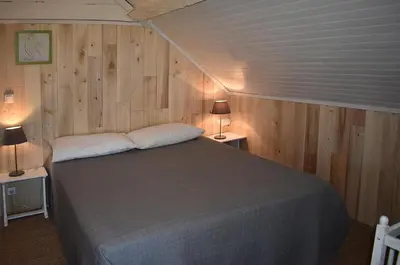 Un ou plusieurs lits dans un hébergement de l'établissement Vialard Haut piscine privée au nord de Sarlat