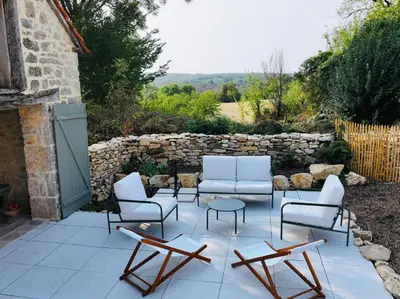 Coin salon dans l'établissement Les Hauts de Paunac - Family home