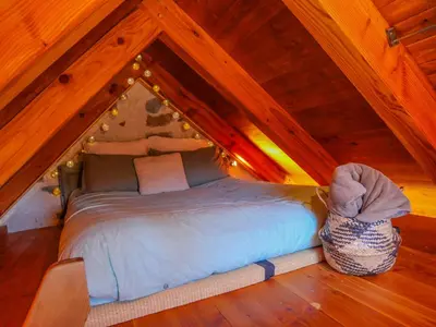 Un ou plusieurs lits dans un hébergement de l'établissement Mini maison terrasse vue montagne proche Puy Mary