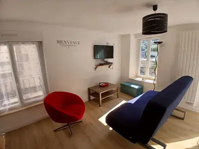 Télévision ou salle de divertissement dans l'établissement T3 duplex au Mont Dore