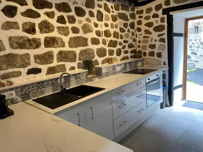 Cuisine ou kitchenette dans l'établissement La maison du Chateau