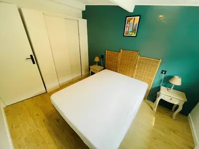 Un ou plusieurs lits dans un hébergement de l'établissement Petit appartement tout confort