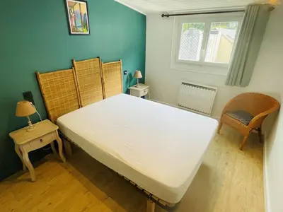 Un ou plusieurs lits dans un hébergement de l'établissement Petit appartement tout confort