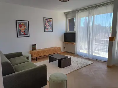Télévision ou salle de divertissement dans l'établissement Appartement en RC au bord du lac