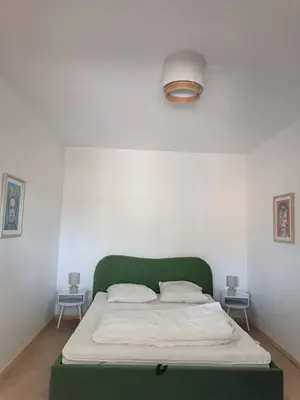 Un ou plusieurs lits dans un hébergement de l'établissement Appartement en RC au bord du lac