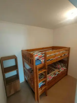 Un ou plusieurs lits dans un hébergement de l'établissement Appartement en RC au bord du lac
